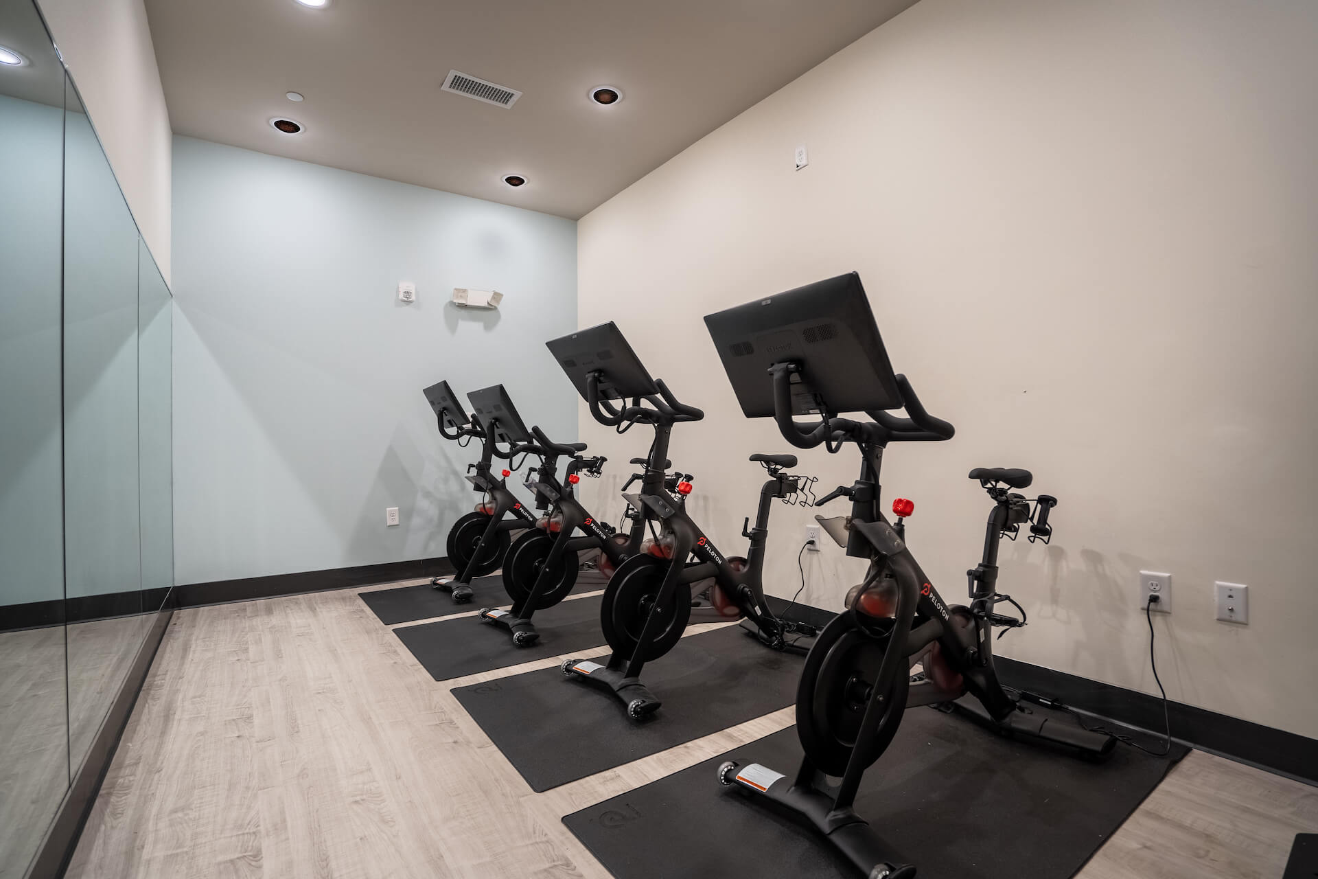 four stationary bikes inside summit place apartments